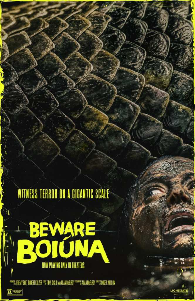 Movie poster for 'Beware Boiúna' featuring a close-up of a reptilian texture with a fearful face partially submerged, and bold yellow text announcing the film's release.